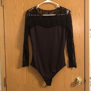 Black body suit, new without tags, never worn.